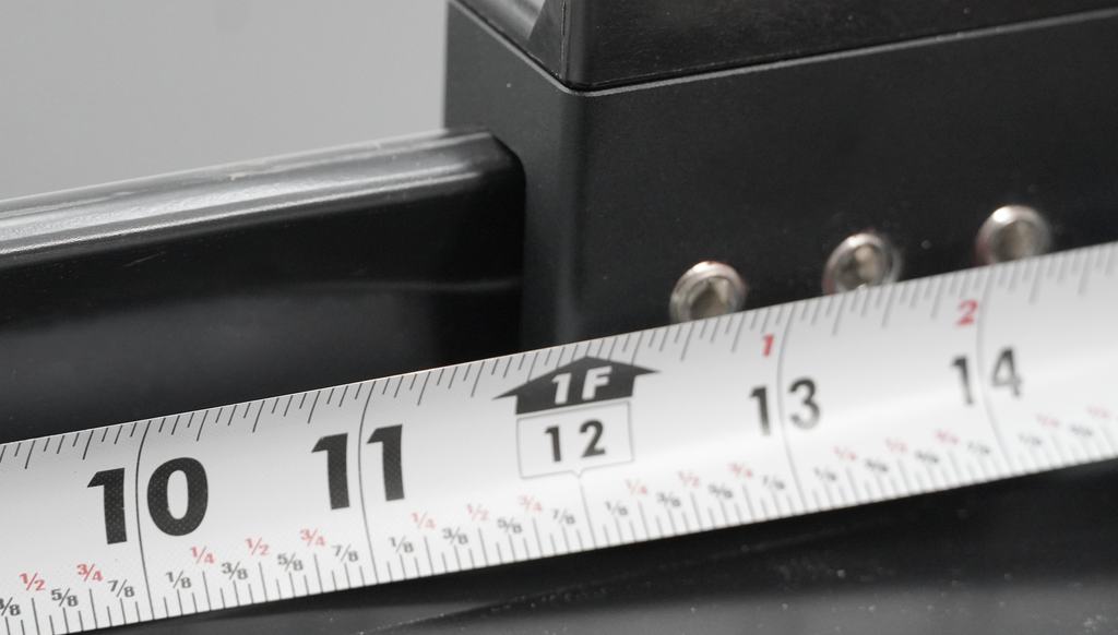 Measuring off the back edge of a Universal Clamp with a tape measure